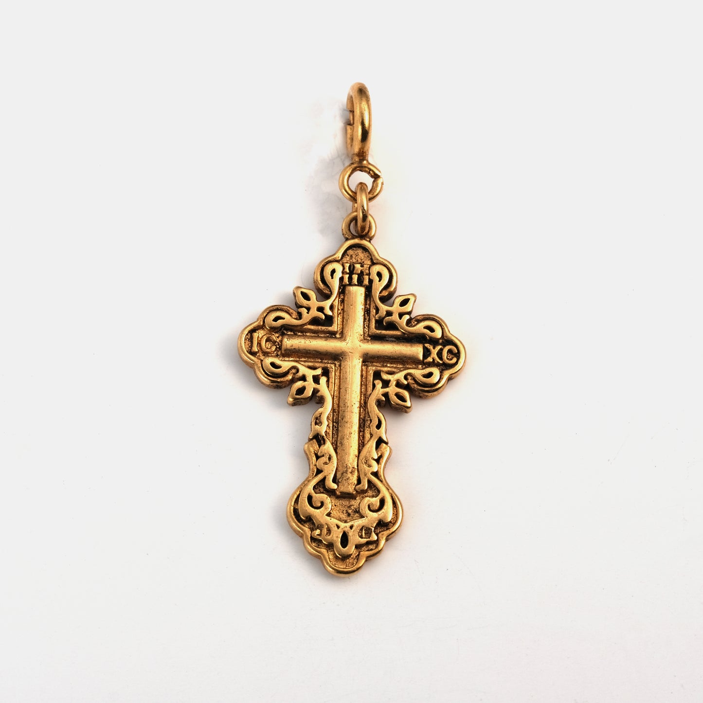 Decorated cross pendant